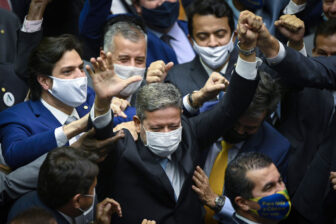 Brazil's president of the Chamber of Deputies Arthur Lira celebrates his election to the post surrounded by fellow legislators on the floor of the Camara dos Deputados..