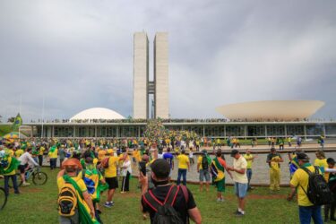 Hundreds of supporters of Brazil's far-right ex-president Jair Bolsonaro broke through police barricades and stormed into Congress, the presidential palace and the Supreme Court Sunday, in a dramatic protest against President Luiz Inacio Lula da Silva's inauguration last week. (Photo by SERGIO LIMA/AFP via Getty Images)