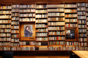 A large row of books and portraits of Mexican intellectuals line the rows of the Library of Mexico, in Mexico City.