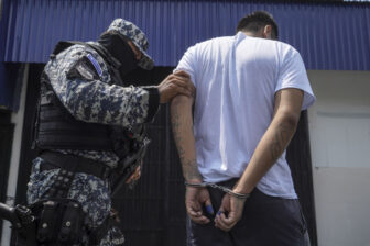 A suspected gang member is arrested in El Salvador as part of President Nayib Bukele's crackdown on gangs through mass arrests.