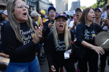 Demonstrators shout slogans demanding better wages during the International Workers Day March in Caracas, Venezuela on May 1, 2023. (Photo by Javier Campos/NurPhoto via Getty Images)