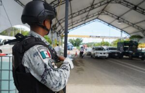 A Mexican National Guard member monitors a checkpoint in Chiapas, Mexico, in June 2023.