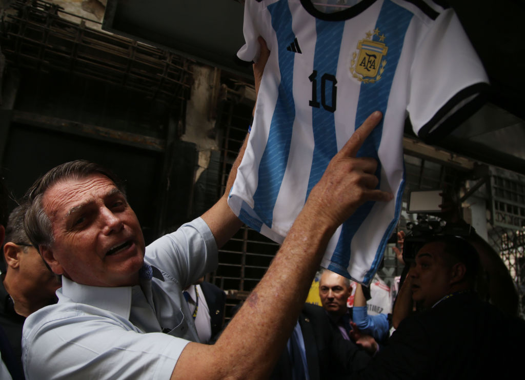 Former President of Brazil Jair Bolsonaro poses with an Argentina jersey, after visiting Argentine President Javier Milei in Buenos Aires in December.