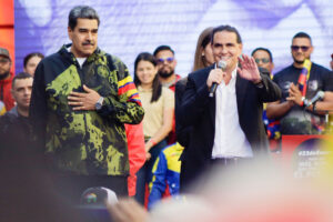 Venezuelan President Nicolas Maduro and his financier Alex Saab speak at a rally in the days before Maria Corina Machado, an opposition leader, was officially barred from participating in Venezuela's 2024 presidential elections.