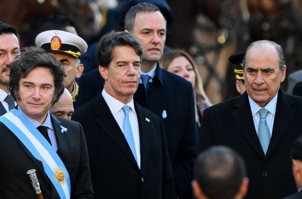 Argentine President Javier Milei (L) accompanied by Argentina's Chief of Staff Nicolas Posse (C) and Argentina's Interior Minister Guillermo Francos (R) arrive to the Metropolitan Cathedral in Buenos Aires on May 25, 2024. Francos will assume as Argentina's Chief of Staff after the resignation of Nicolas Posse, Milei's government reported in a statement on the social network X. (Photo by LUIS ROBAYO / AFP) (Photo by LUIS ROBAYO/AFP via Getty Images)