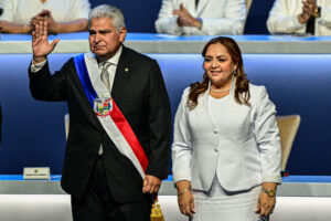 President José Raúl Mulino (L) waves next to National Assembly President Dana Castañeda at his inauguration in Panama City on July 1.