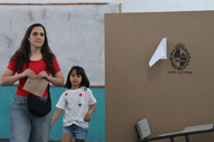 A woman votes during the presidential election on October 27, 2024 in Canelones, Uruguay.