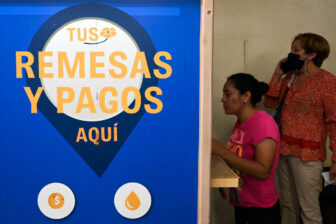 A woman withdraws a dollar remittance from the U.S. in Tegucigalpa, Honduras in April.