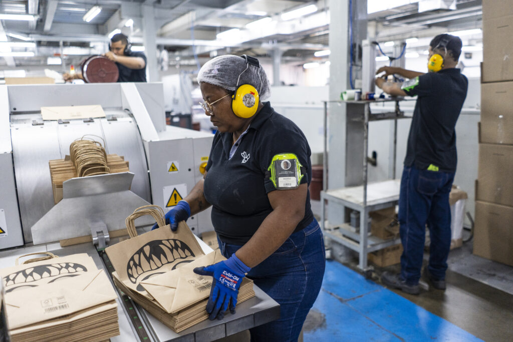 Workers make Rappi Turbo paper bags at the Ditar manufacturing facility in Barranquilla, Colombia, in September.