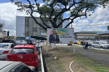 Guyana’s Promise Is Still a Work in Progress. View of one of Georgetown's main avenues. A billboard features President Irfaan Ali in November 2023.