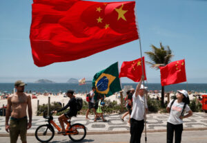 Bystanders await President Xi Jinping during the G20 Meeting in Rio de Janeiro in Nov 2024.