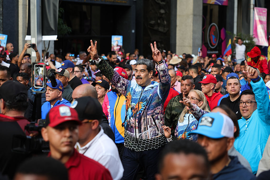 Venezuelan President Nicolas Maduro takes part with First Lady and candidate for the National Assembly, Cilia Flores, in a march marking the end of the electoral campaign on May 22, 2025 in Caracas, Venezuela. On May 25, Venezuelans will vote in the local elections for 285 members of the National Assembly, 24 governors, and 260 legislators to state legislative councils.