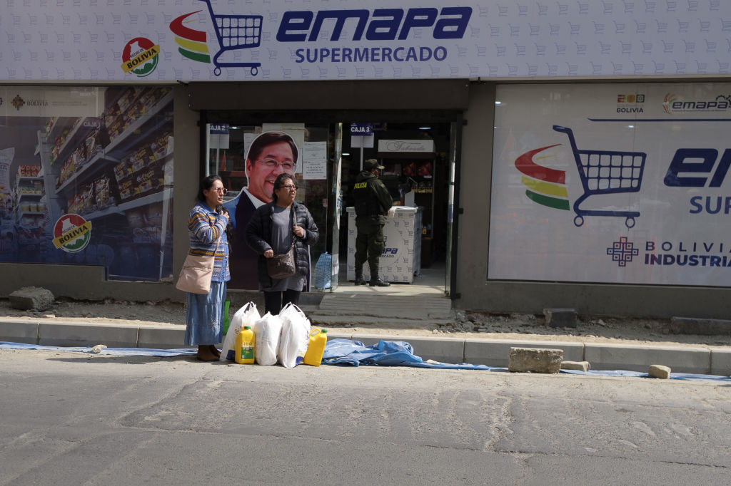 Customers outside a subsidized grocery store in La Paz in Sept. 2024. To Escape Economic Crisis, Bolivia Has a Painful Road Ahead: Whoever wins this year’s election, the next president will face the daunting task of implementing bitter reforms.