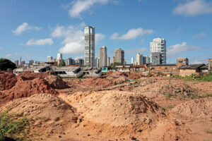 A former community soccer field in the low-income area of Vila da Barca has been turned into a debris dump for waste generated by COP30 construction.