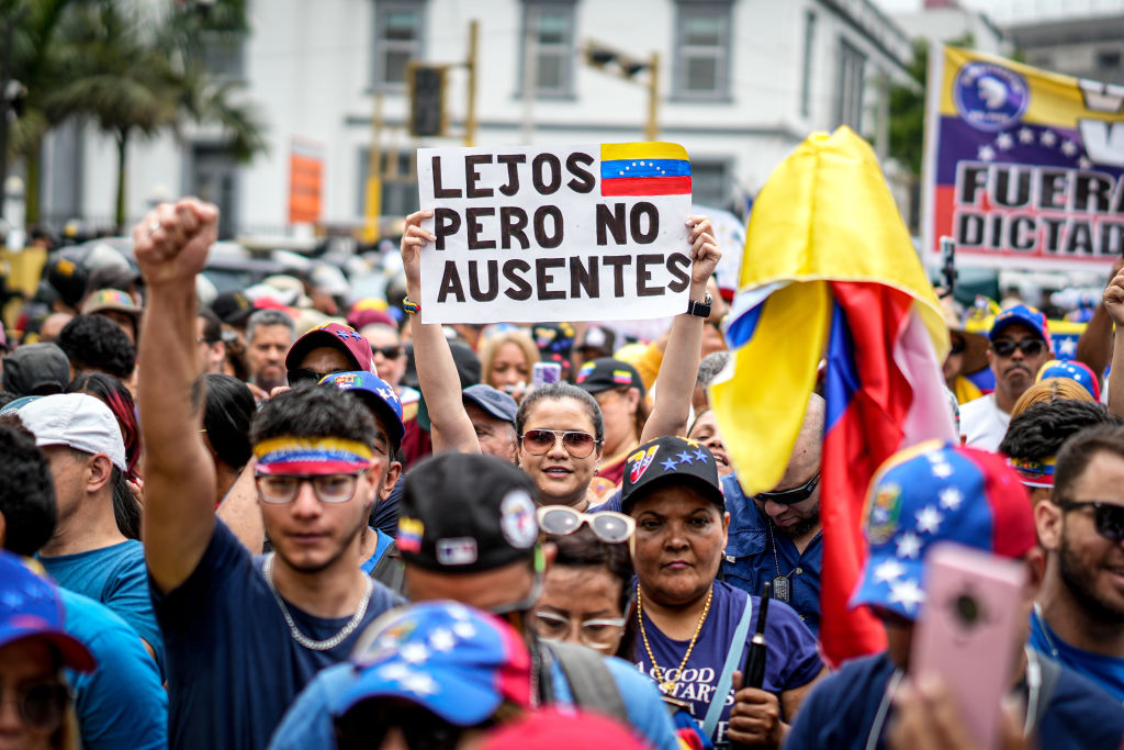 Venezuelan migrants outside the Venezuelan Embassy in Lima protesting against President Nicolas Maduro in January. The Future of Venezuela’s Diaspora