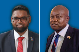 Guyanese President Irfaan Ali (left) and legislator Aubrey Norton