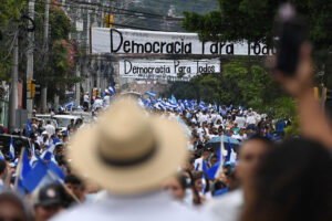 Supporters of the opposition National Party march in Tegucigalpa in July.