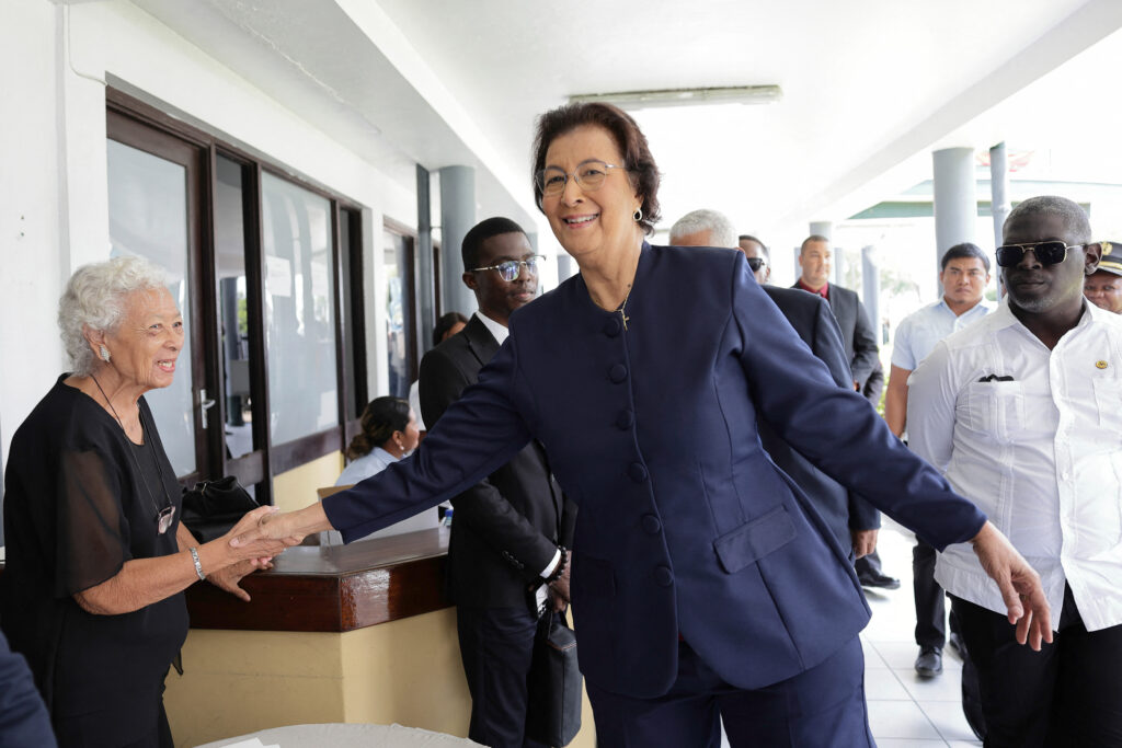 Geerlings-Simons greets a woman in Paramaribo after her election victory in May.