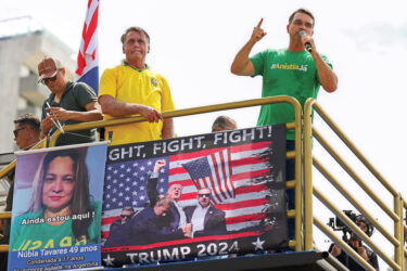 Jair Bolsonaro, left, and his son Flávio address supporters at a rally in Rio de Janeiro in March 2025.