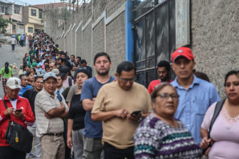 Voters wait at a Lima polling station on Monday, April 13, after logistical problems led Peru's elections authorities to extend voting to a second day.