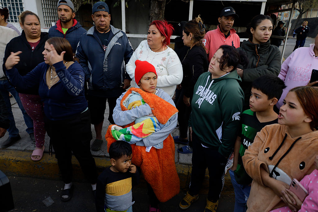 Migrants at a camp in Mexico City resist an eviction attempt by city authorities in February.