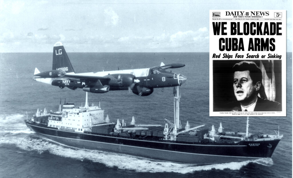 A P2V Neptune U.S. patrol plane flies over a Soviet freighter during the Cuban missile crisis in 1962. Inset: Front page of the New York Daily News on October 23, 1962.