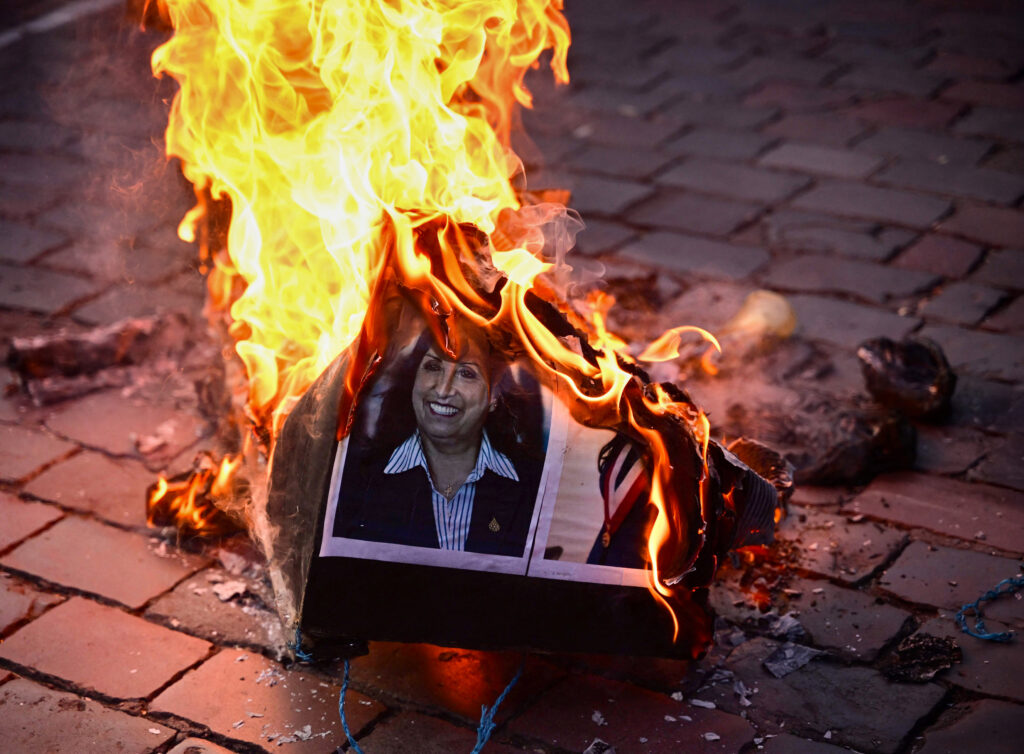 Following a protest in December 2022, debris from a burned-out fake coffin of Peru’s then-President Dina Boluarte lies in Cusco’s Plaza de Armas.