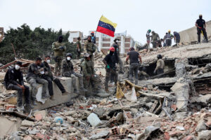 Rescuers search for victims at a collapsed building on June 28, 2026 in La Guaira, Venezuela.