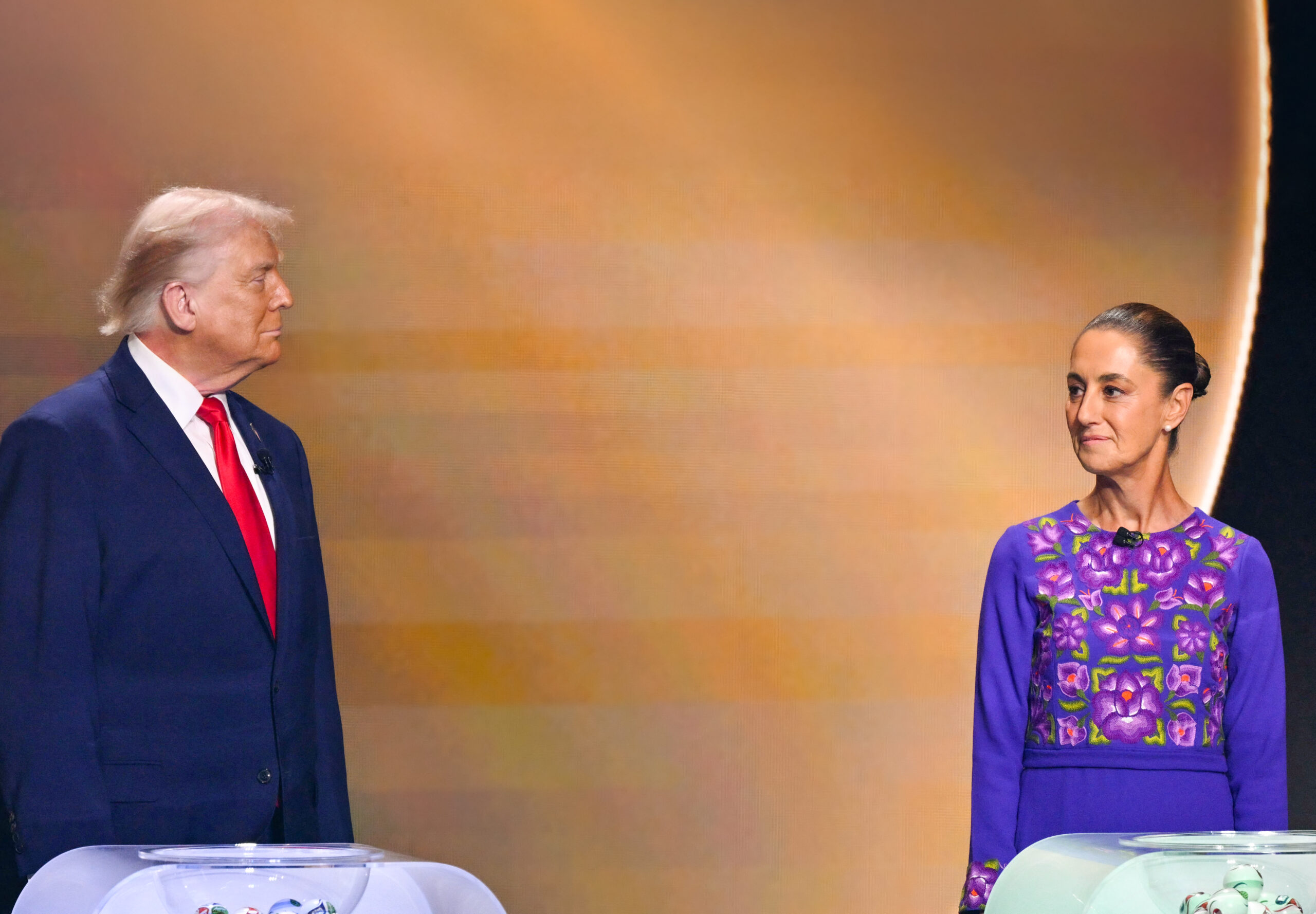 U.S. President Donald Trump and Mexico’s President Claudia Sheinbaum stand on stage during the draw for the 2026 FIFA Football World Cup at the Kennedy Center in Washington, D.C., in 2025.